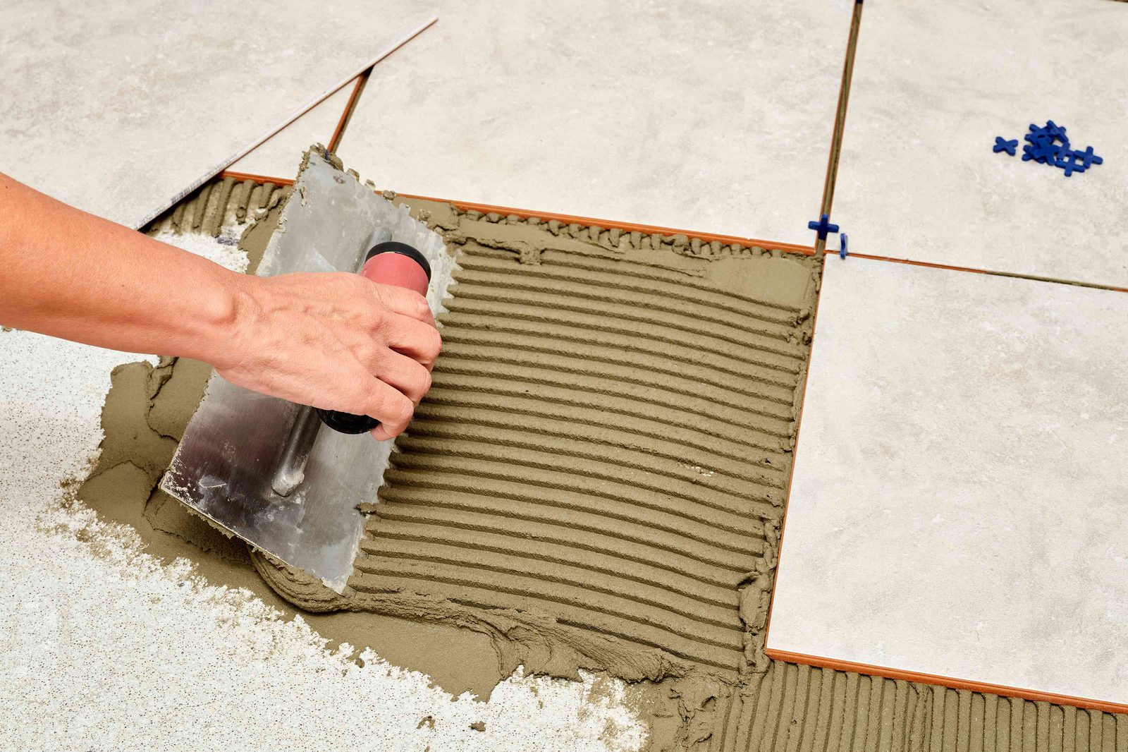 Tile installer at work on a Greenville, SC job site