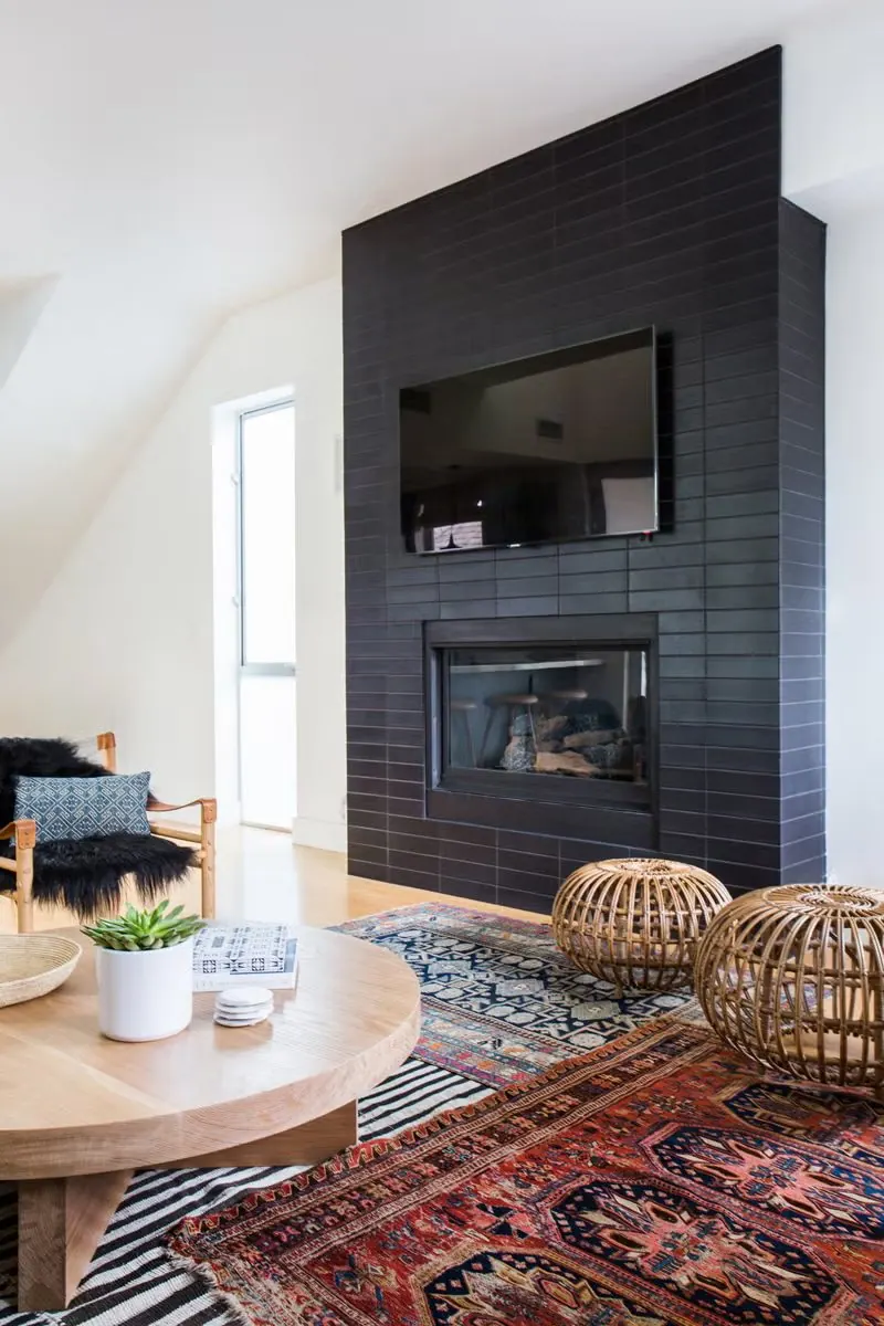 Dark tiled fireplace surround installed by Tile with Style in a Greenville, SC living room