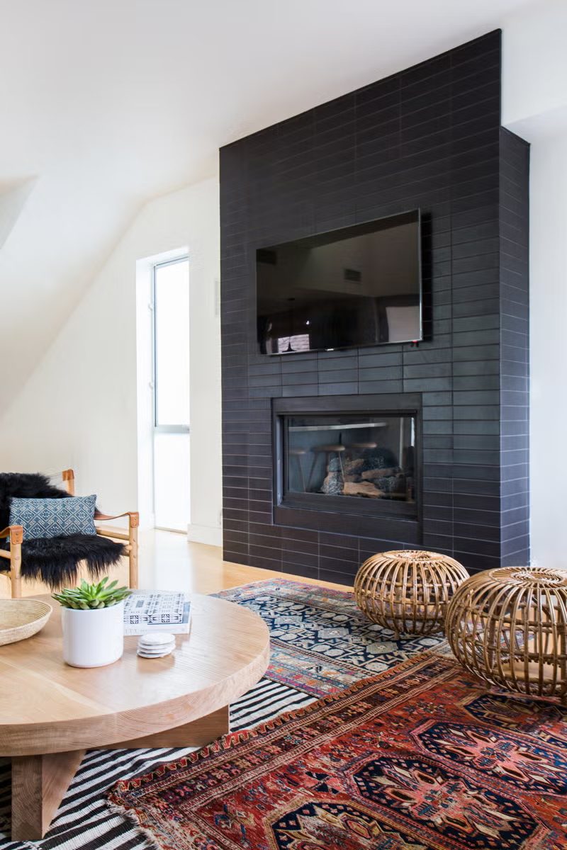 Dark tiled fireplace surround installed by Tile with Style in a Greenville, SC living room