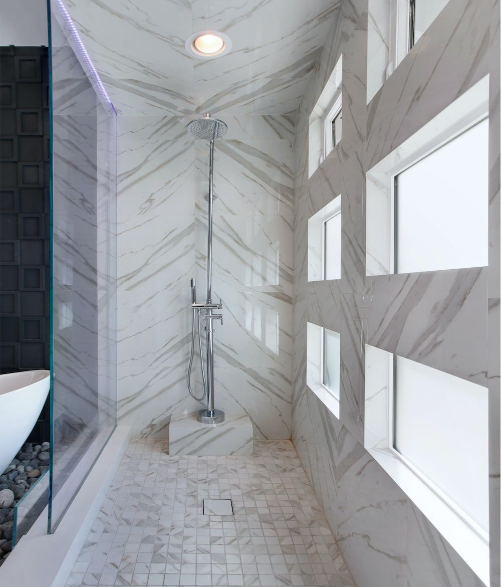 Custom tiled walk-in shower with mosaic floor installed by Tile with Style in Greenville, SC